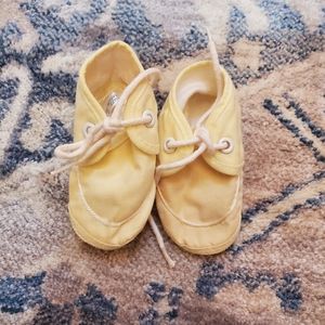 Yellow baby shoes